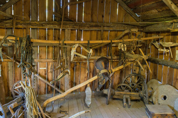 Old agricultural implements in a barn