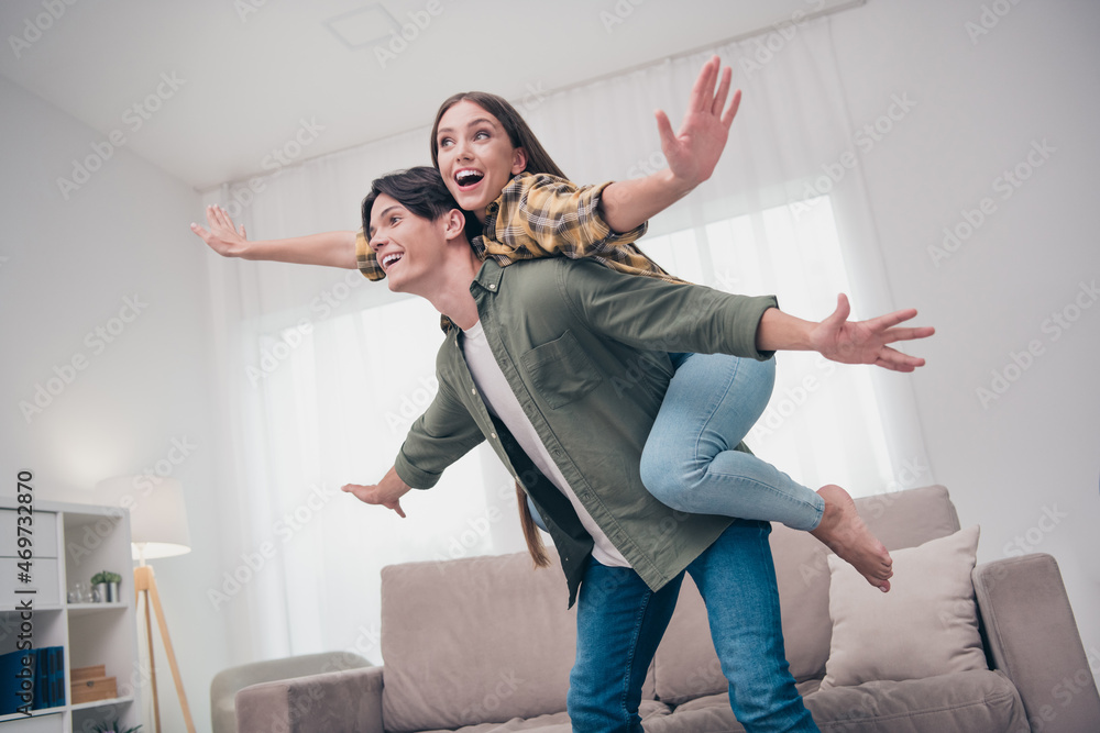 Canvas Prints photo of attractive excited young couple wear casual outfits smiling arms sides flying spending free