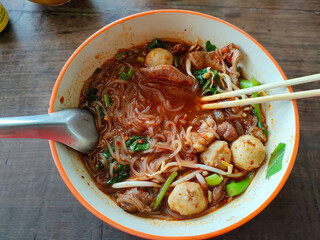 Thai boat noodles is Thailand's most famous noodles soup,Thai Boat noodles soup or Guay tiew reua ,Rice noodles thicken soup with stewed beef and beef ball. selective focus the beef ball