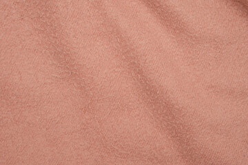 Texture of soft pink fleecy fabric.