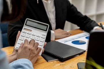 The company's finance manager is using a calculator, he uses a calculator to calculate the numbers in the company's financial documents that employees in the department create as meeting documents.
