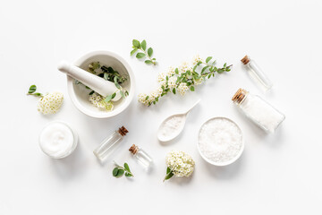 White organic cosmetics products with white flowers