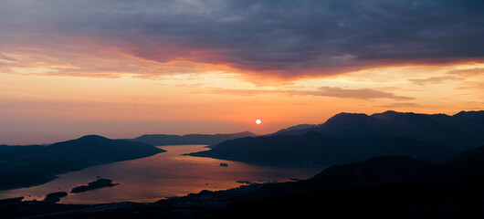Naklejka na ściany i meble View from Mount Lovcen to the red sunset over the Bay of Kotor