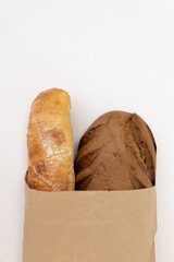 paper bag with bread on white background