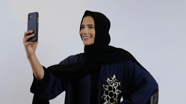 Beautiful Arab Middle Eastern woman on Abaya and Hijab ideal for modern business concept