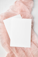 Two white invitation card mockup on rose delicate gauze 5x7