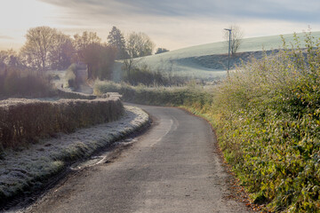 Morning frost covered green grass meadow on the mountain, Landscape view of hilly countryside in South Limburg (Zuid-Limburg) Gulpen is a village in the southern of the Dutch province, Netherlands.