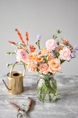 Finished flower arrangement in a vase for home. Flowers bunch, set for interior. Fresh cut flowers for decoration home. European floral shop. Delivery fresh cut flower.