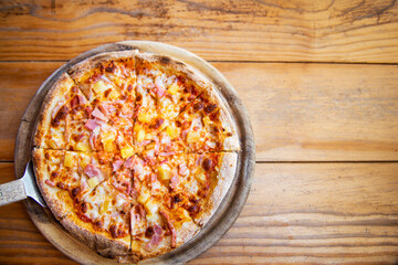 Hawaiian Piiza on tray, ready to serve
