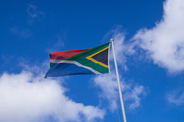 South Africa National flag moving on blue sky background