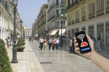 Public WiFi hotspot connection, city street, access internet on smartphone.
