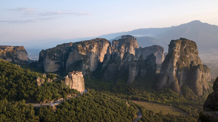 Landscape with monasteries and rock formations in Meteora during sunset, Greece.