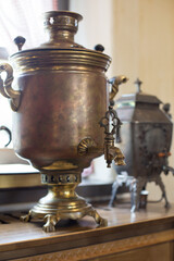 Fototapeta na wymiar Antique samovar made of copper and bronze