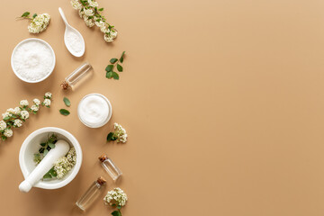 White medical herbal cosmetics in flowers - with skin cream and bath salt