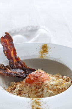 Delicious breakfast of fried eggs and bacon slices