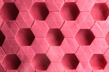 origami  hexagonal star tessellation - pink paper macro - close up - screen background