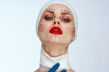 portrait of a woman in blue gloves syringe in hands contour on the face lifting close-up