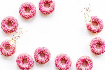 Pink glazed donutes background - set of donuts with icing