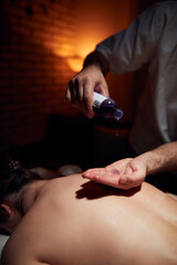 Woman on a massaging, chiropracting table, treatment of body and skin tension.