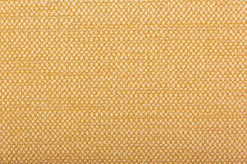 Factory fabric with brown and white threads interspersed. Close-up long and wide texture of natural...