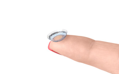 Colored lens on the hand finger isolated on white background.