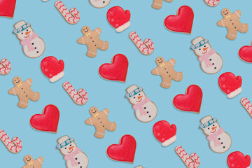 Creative pattern made with homemade Christmas  Gingerbread cookies isolated on pastel blue background.