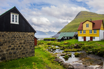 Fototapeta na wymiar A few small houses in a village called Gjogv on the Faroe Islands