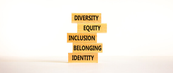 Diversity, equity, inclusion, belonging, identity symbol. Wooden blocks with words Diversity, equity, inclusion, belonging, identity on beautiful white background. Business, Inclusion concept.