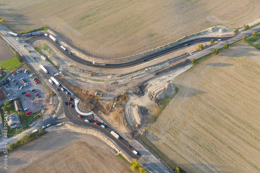 Wall mural Roundabout under construction Top down aerial view of a traffic roundabout. Aerial view. Solving the problem of jams. Road construction