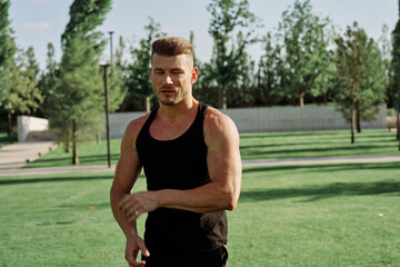 Fototapeta premium sports man in the park exercise fitness cardio