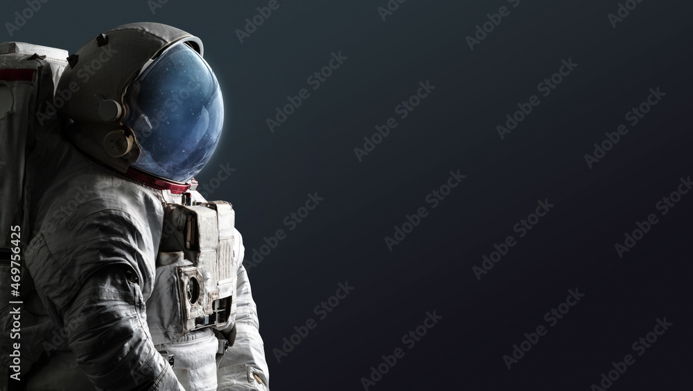 Aufkleber astronaut isolated on dark background. spaceman with space and stars in helmet. creative sci-fi spac