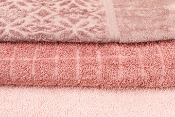 Three pink towels - abstract background.