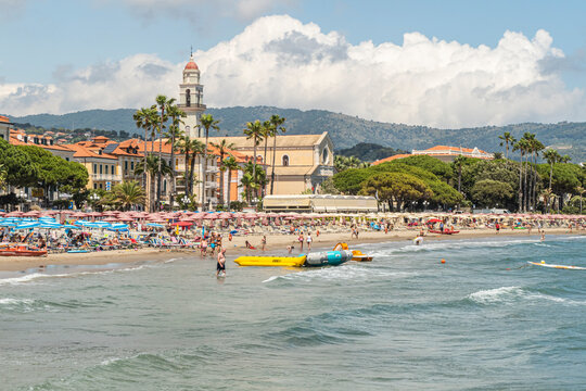 The beach of Diano Marina with a beautiful church in background