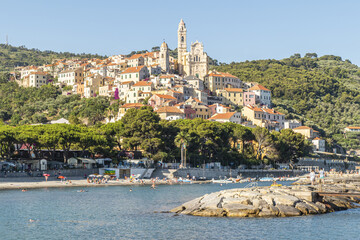 Cervo beach with its characteristic rocks and the beautiful town in the background