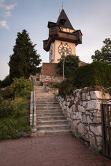 View of the famous clock tower (Uhrturm) on Schlossberg Park hill in a summer morning, Graz, Styria, Austria