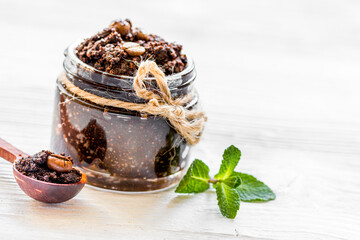 Spa concept with natural coffee scrub on white background