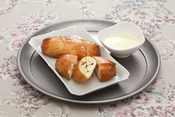 fried steamed silver thread roll with condensed milk.

silver thread roll is a type of chinese bun; steamed bun from shandong province bun with hand-drawn dough threads folded over.
