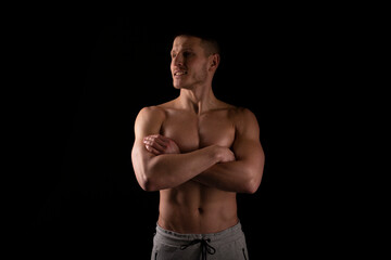 Fototapeta premium Sportsman Hands Crossed Topless Smiling. Healthy Life, Medical protection, Sports Concept. Looking to Side