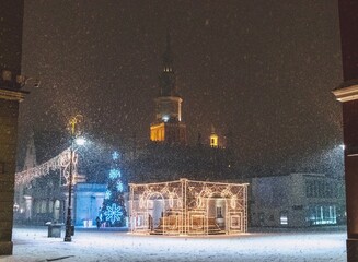 Late-night snowing at the Old Town square in Poznan, Poland