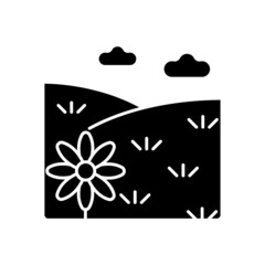 Meadow black glyph icon. Grass covered open land. Field with flowers. Grassland and pastureland. Herb vegetated plain terrain. Silhouette symbol on white space. Vector isolated illustration