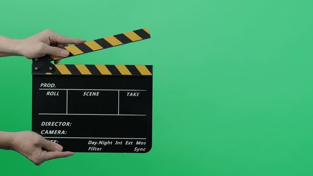 Movie Clapper Board. Hollywood Director Film Slate. Film crew hold and clapping film slate in video recording. Using for cut action or visual effects and scene prop. Clapperboard of movie production.