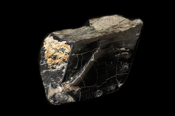 Macro stone mineral jet lignite on a black background
