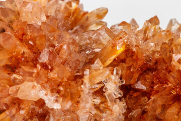 Macro of mineral stone Creedite on microcline on white background