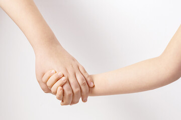 kids holding hands senior and junior friendship and support concept