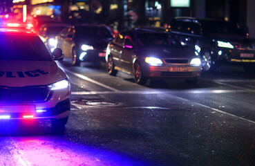 police car in night light city