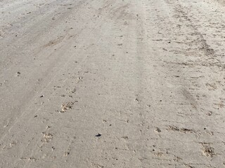 Closeup details of smooth dirt road background