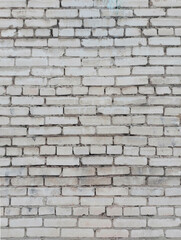 Old white brick wall. Vertical arrangement.