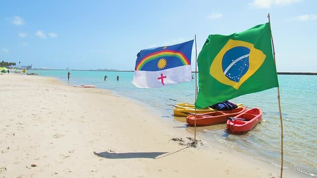 Brazilian and Pernambuco state flags at Muro Alto beach, at Ipojuca PE, Brazil. Northeastern Brazilian beach.