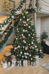 Christmas tree with gifts underneath. Christmas and New Year's decor.
