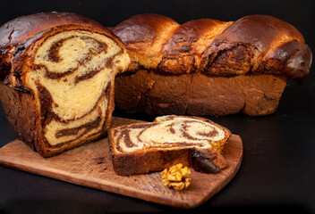 Romanian cozonac on black background